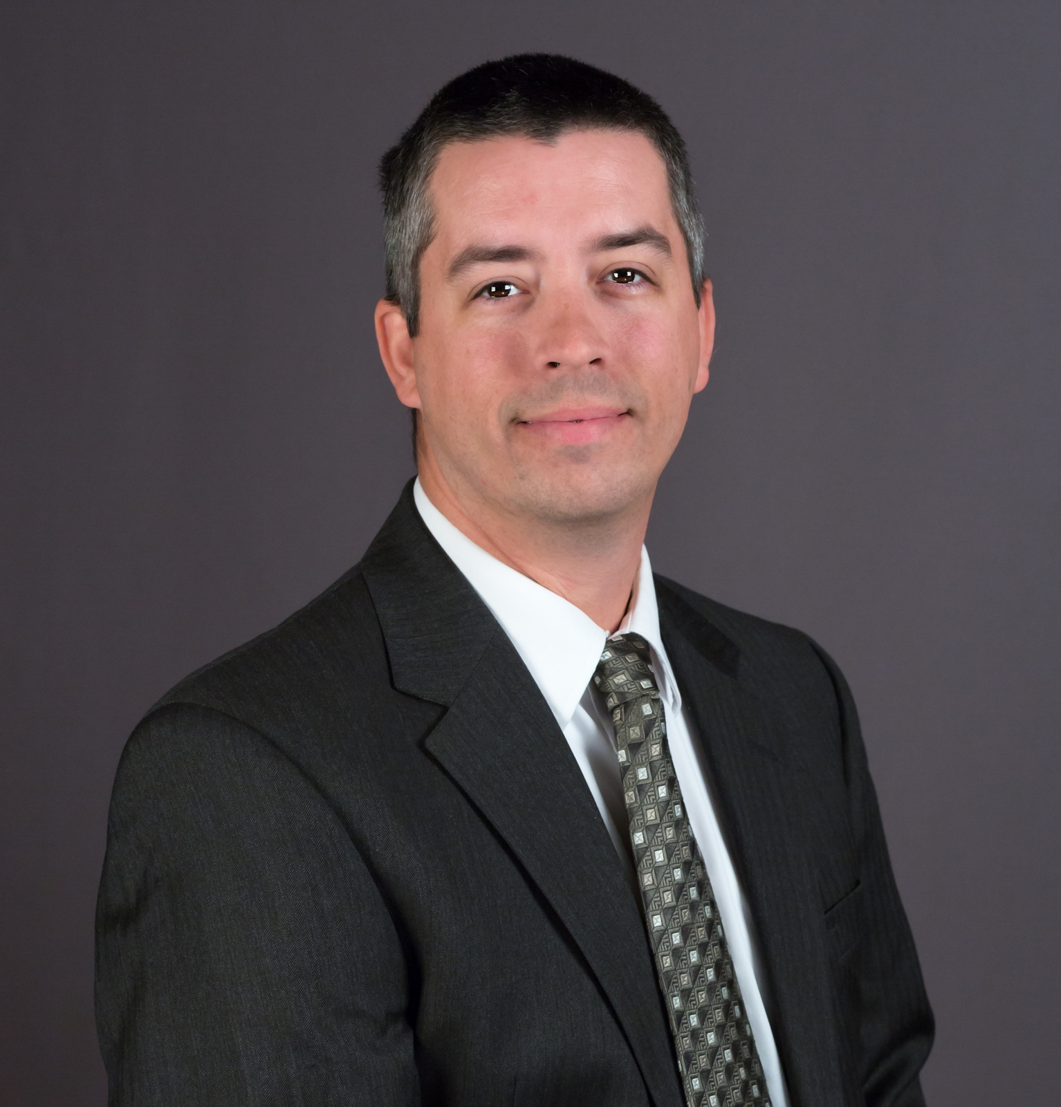 headshot of man in suit